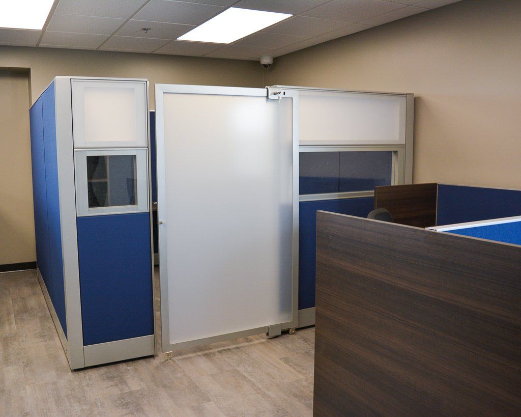 a blue cubicle with closed sliding door