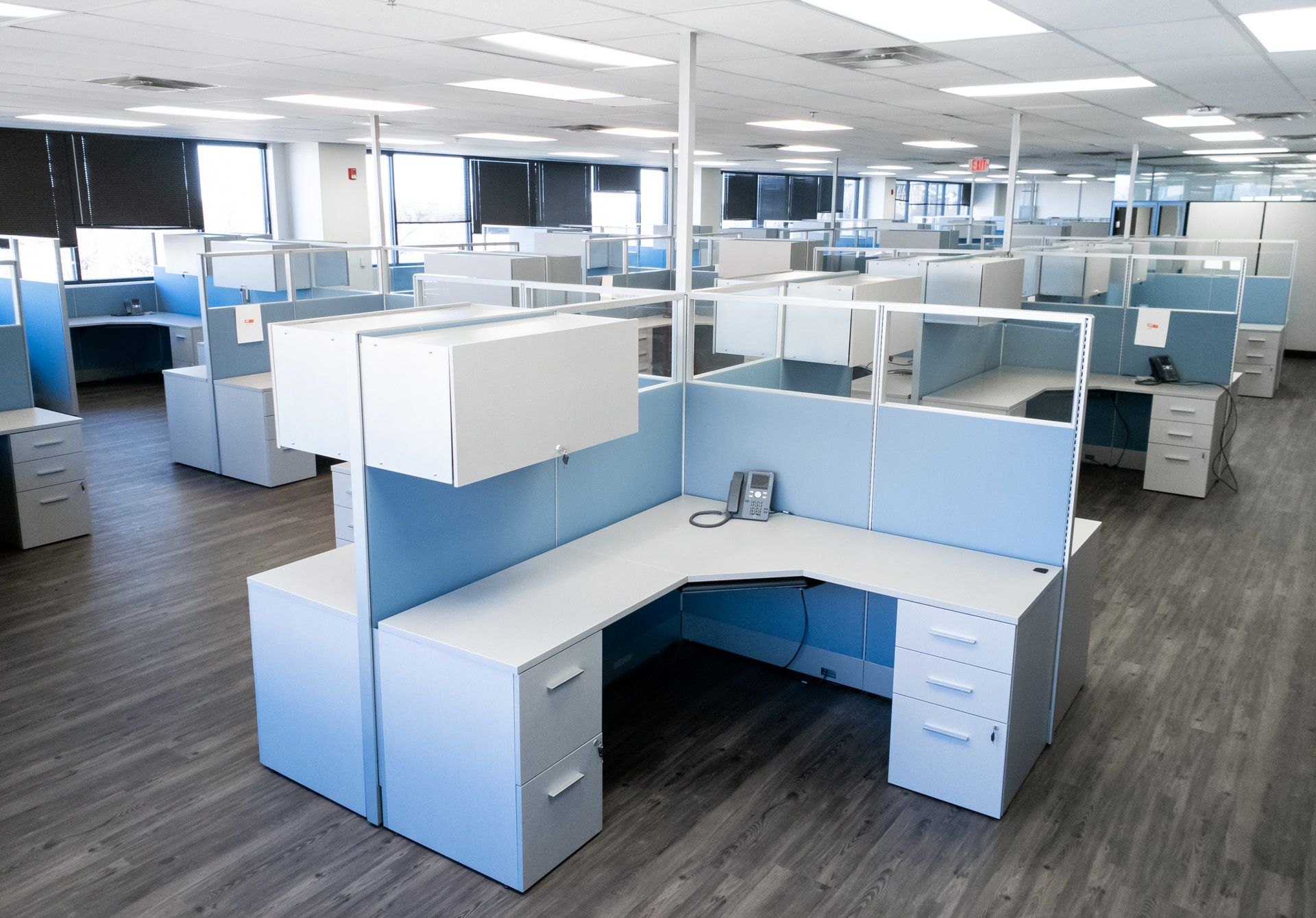 A large office with a lot of cubicles and desks