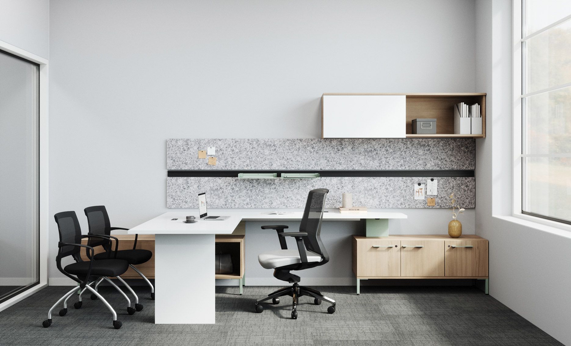 a room with a desk and chairs with wall-mounted storage