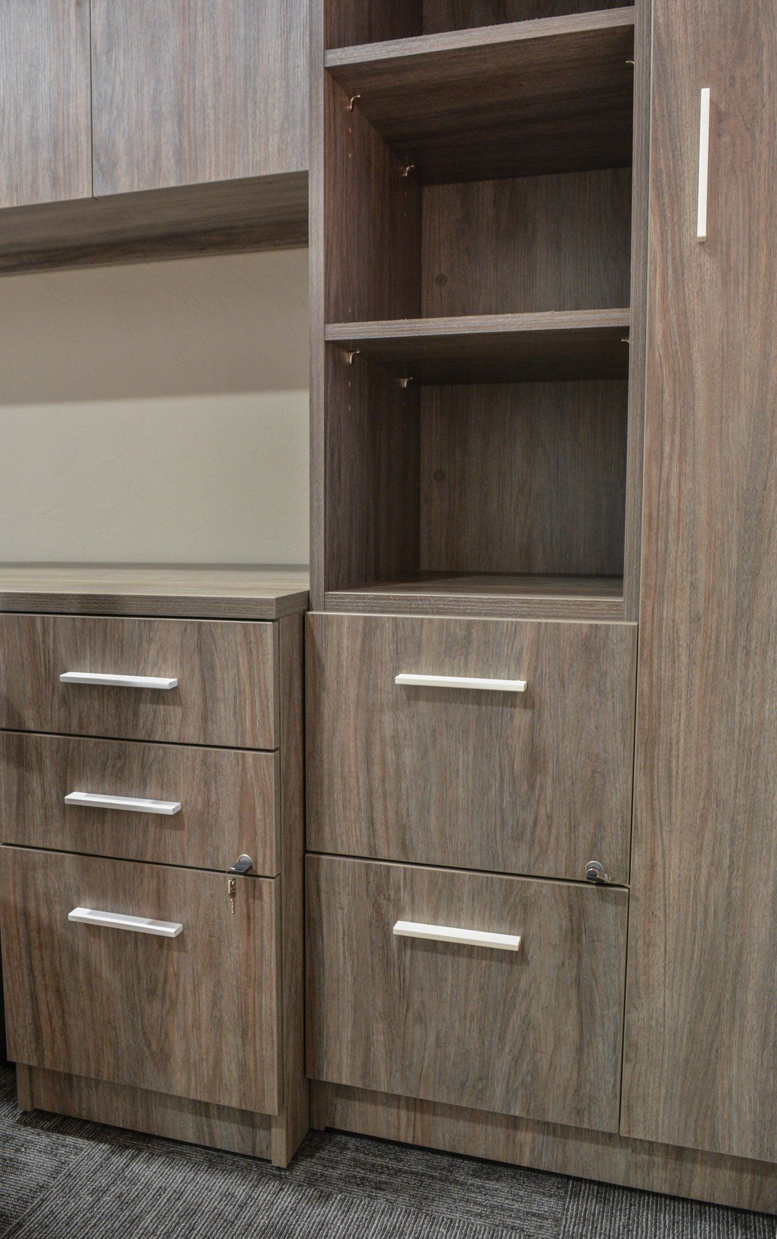 desk file drawers next to tall storage cabinet