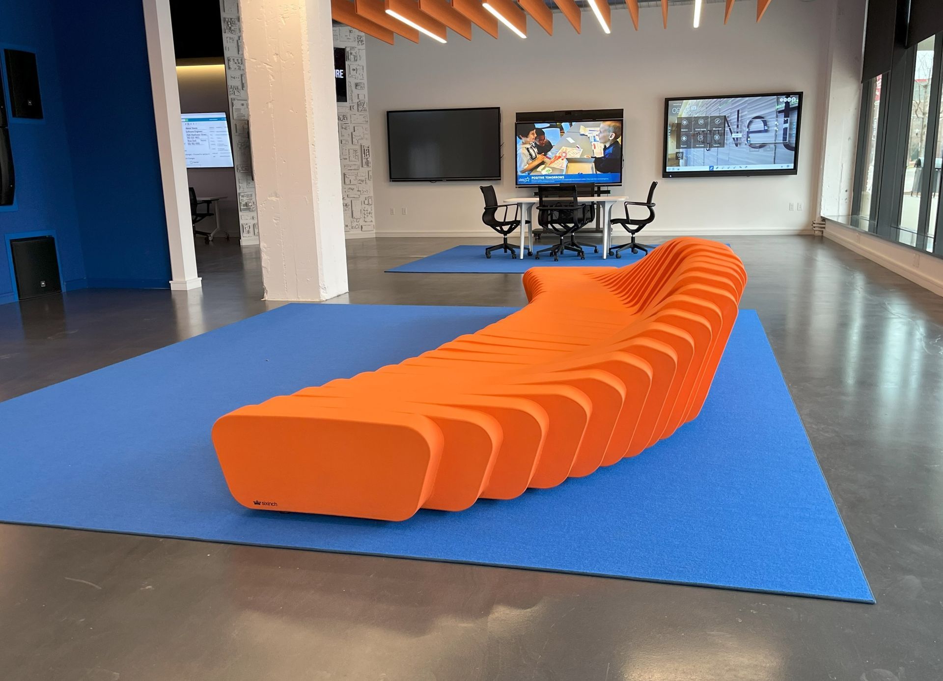 Modular orange sofa on blue rug