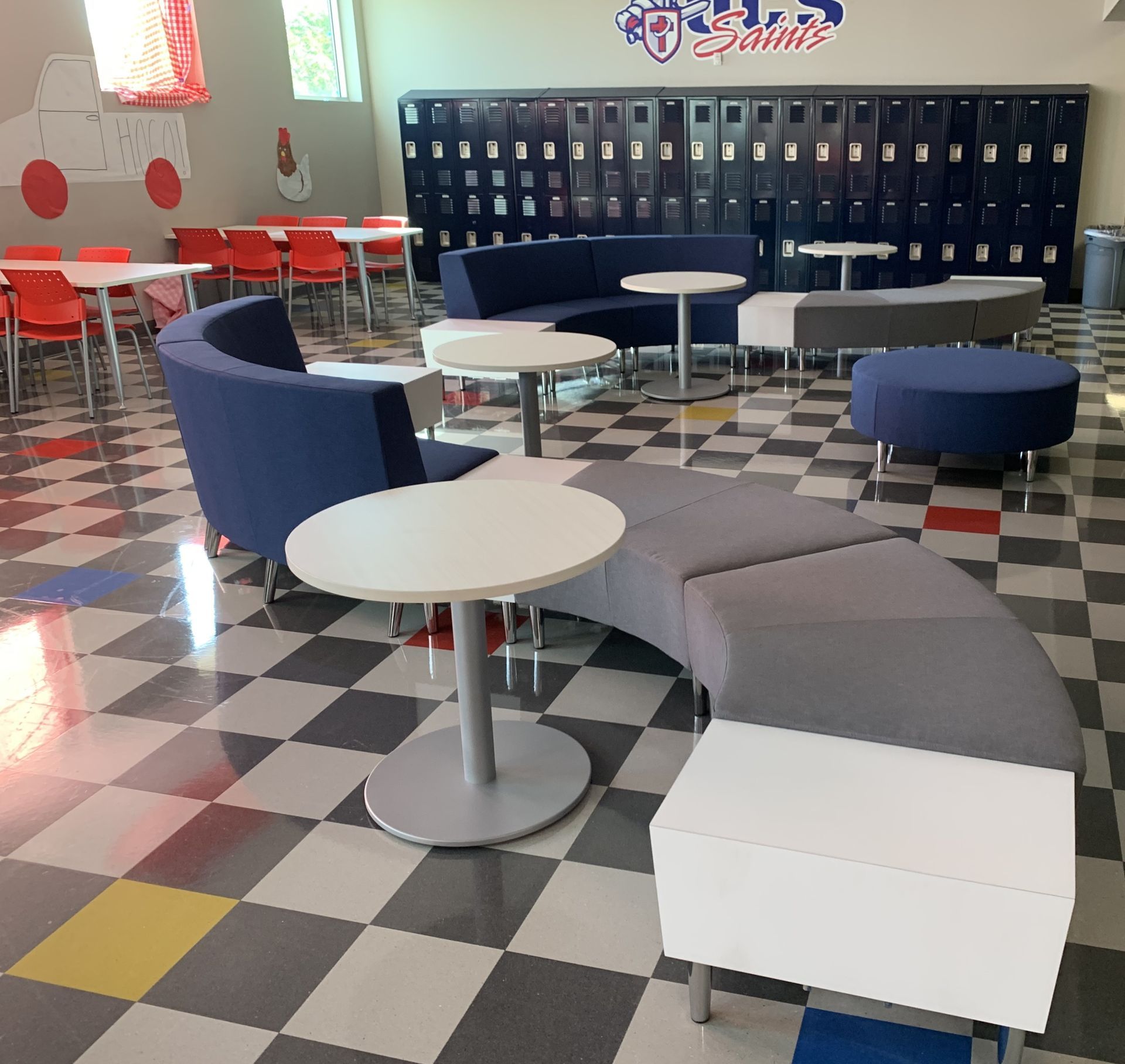 A room with tables and chairs and a sign that says ' smith 's ' on it