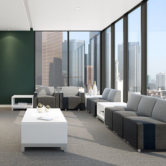 a waiting room with a couch a chair and a coffee table