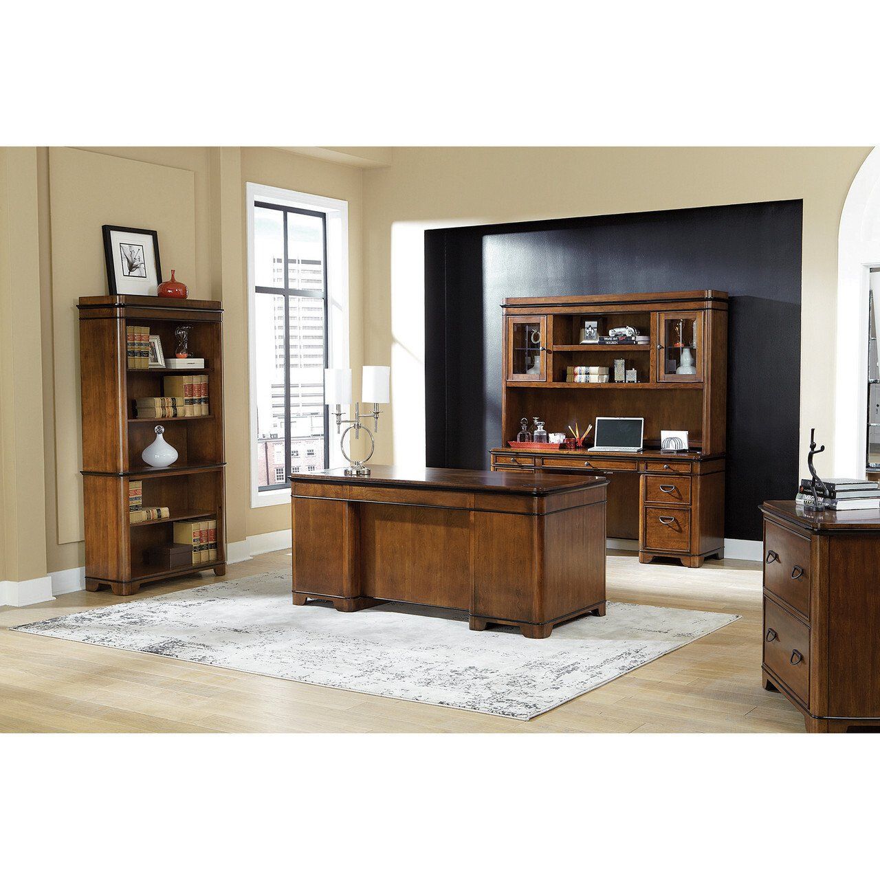 a home office with a desk and a bookcase