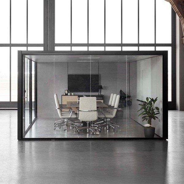 a glass conference room with a table and chairs in it
