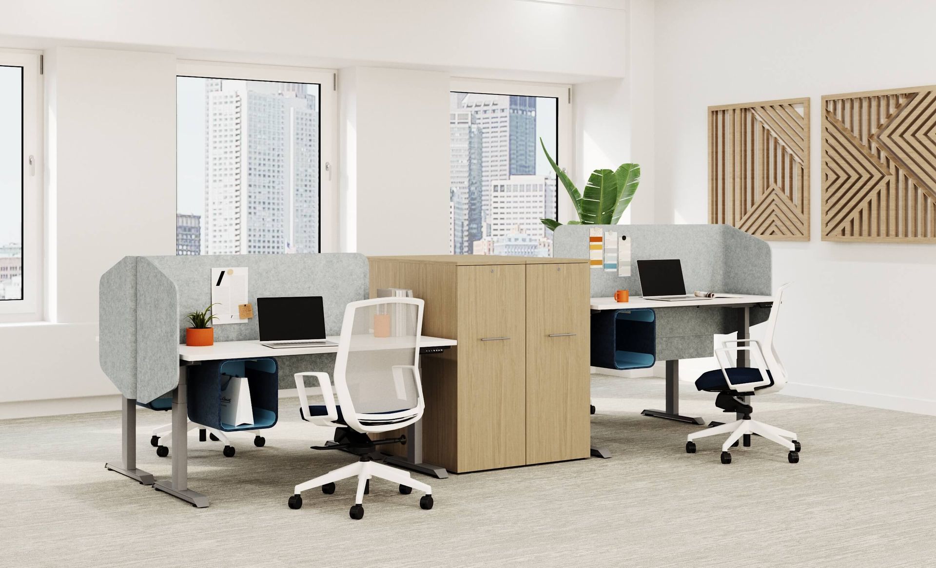 Modern office cubicles with white desks, chairs, and gray dividers. Wooden cabinet in the middle.