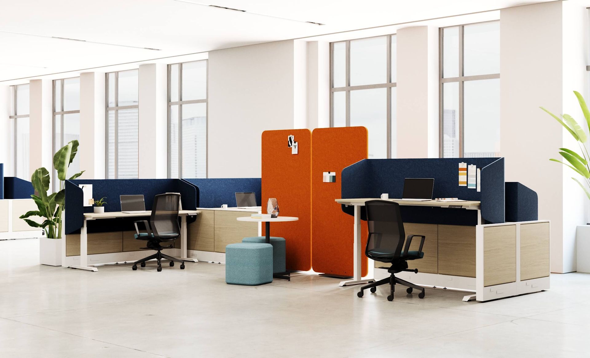 Office space with modern cubicles: blue and orange screens, white desks, black chairs, neutral floor and walls.