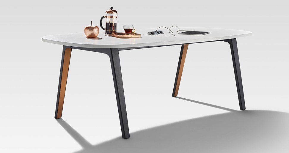 a table with a french press and a cup of coffee on it