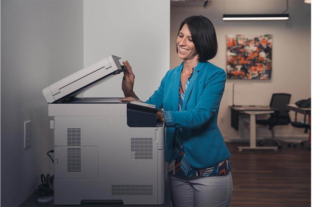 Woman Using Xerox Machine — Safety Harbor, FL — Office Werks