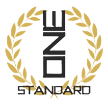 Gold laurel wreath around black vertical logo text above &ldquo;STANDARD&rdquo; on white background