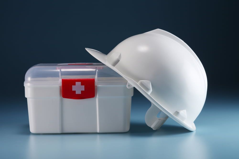 A Hard Hat Is Sitting Next to A First Aid Kit —Revive Training in Byron Bay, NSW