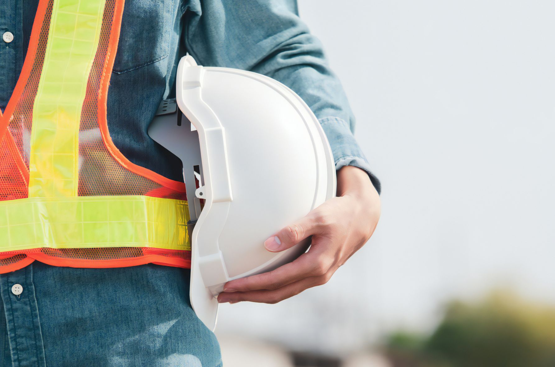 Man Holding A White Safety Helmet —Revive Training in Ballina, NSW