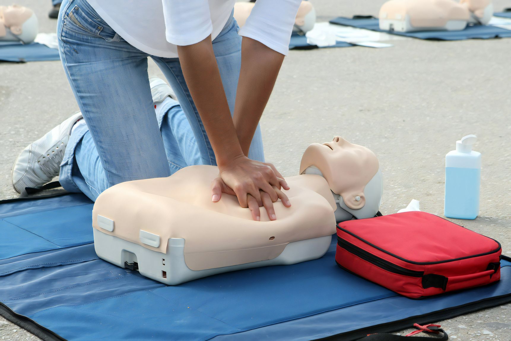 Female Instructor Showing CPR On Training Doll — Revive Training in Alstonville, NSW