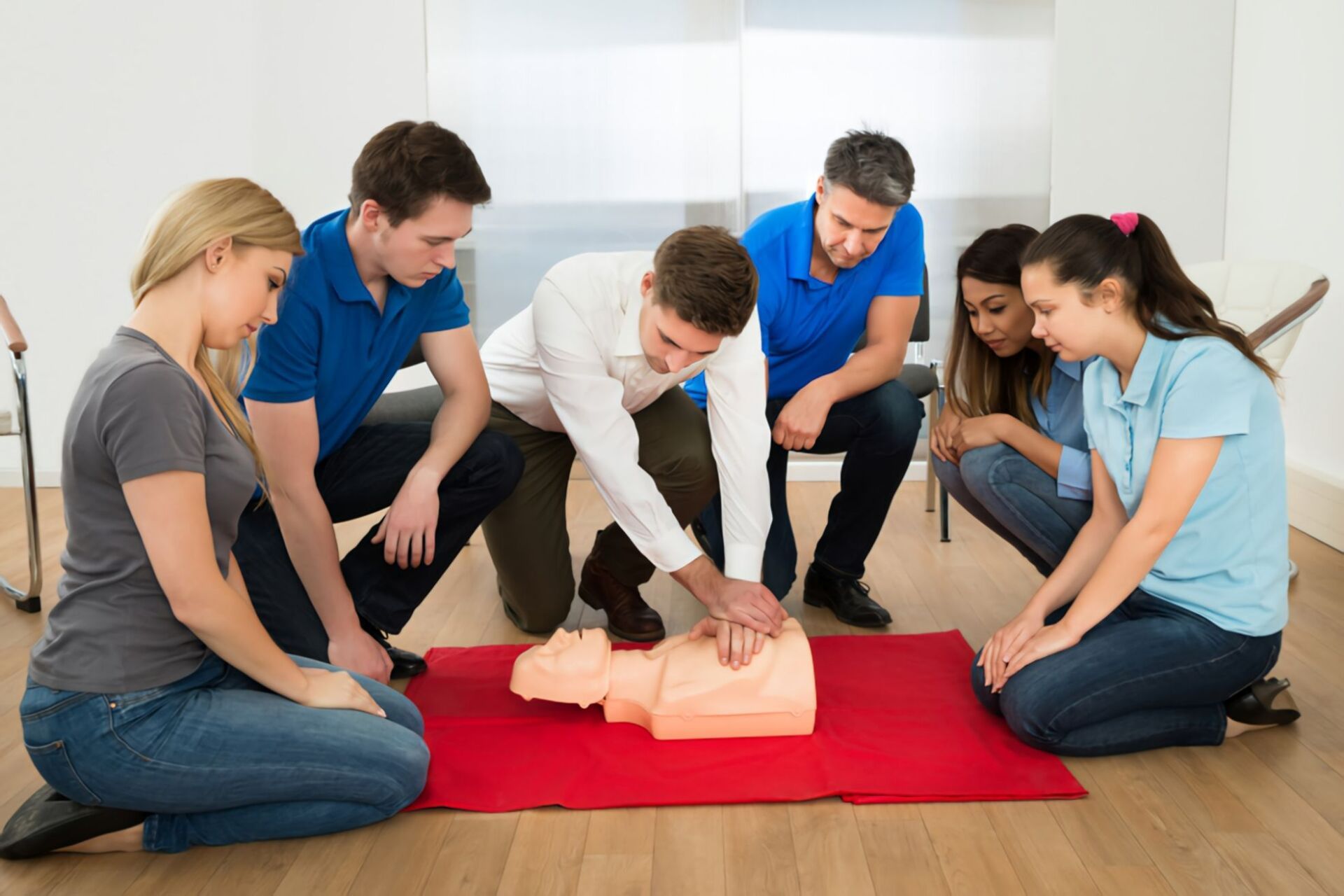 First Aid Instructor Showing Resuscitation Technique On Dummy — Revive Training in Alstonville, NSW