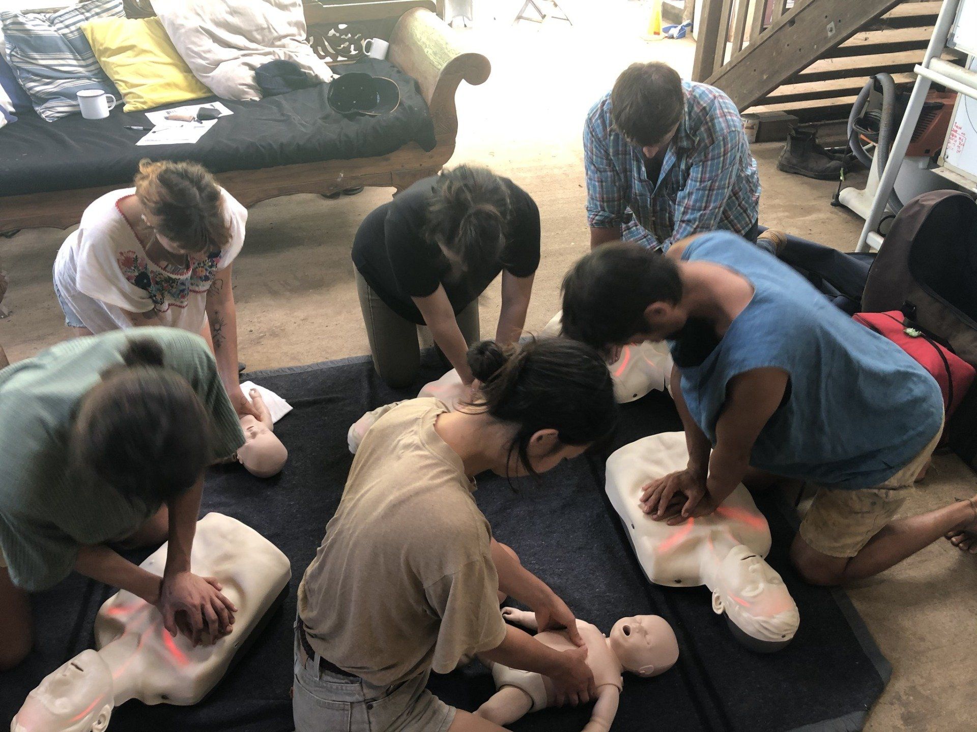 A Group of People Are Practicing First Aid on a Mannequin — Revive Training in Tweed Heads, NSW