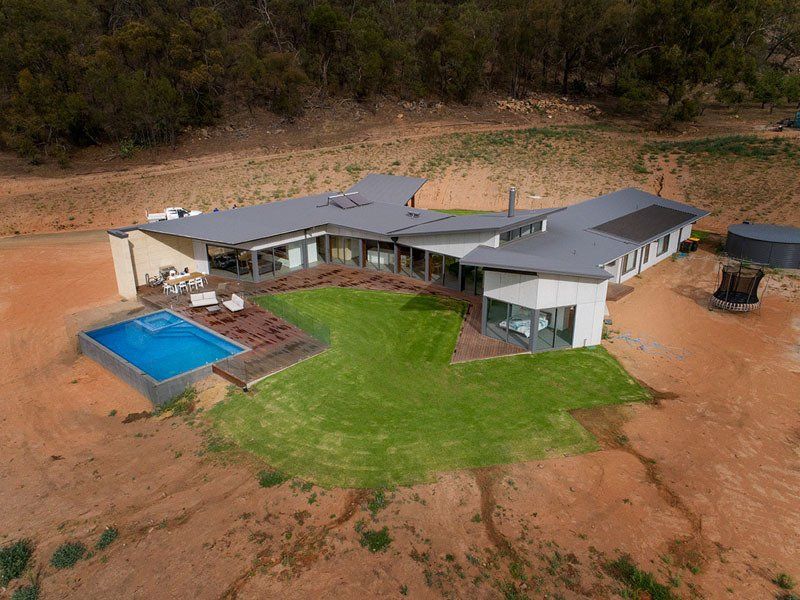 aerial view of a house and a pool