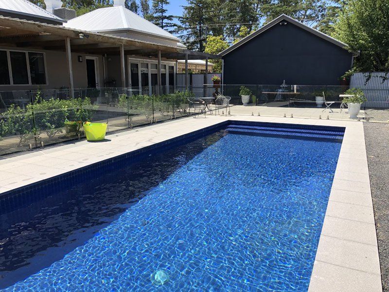 View of outdoor pool with clear water