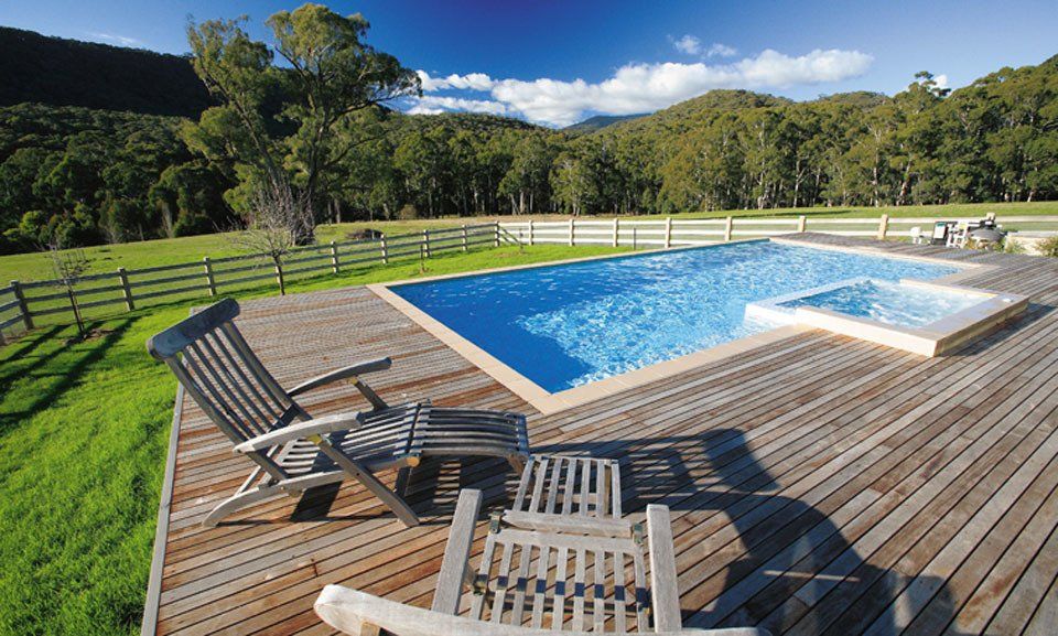 View of outdoor pool with clear water