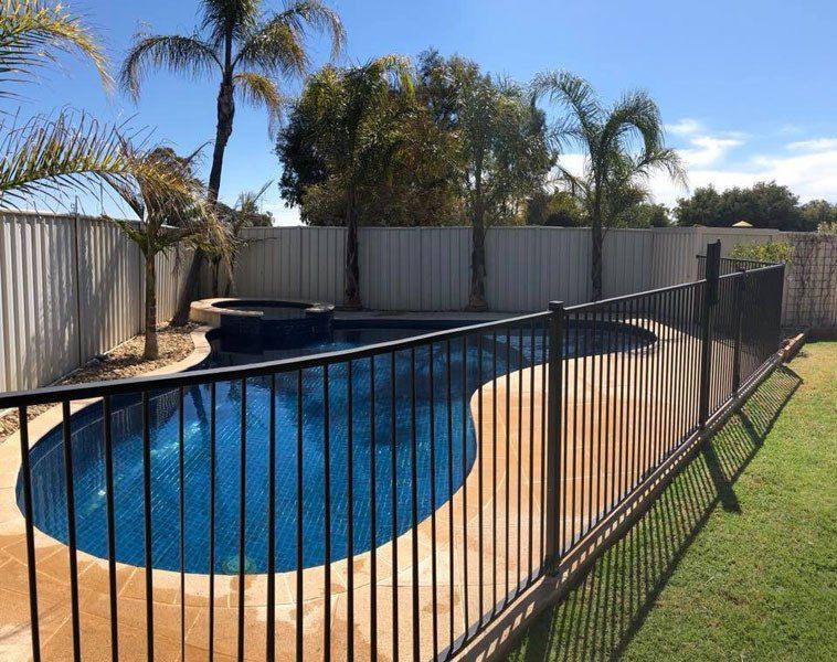 View of a pool with metal fence