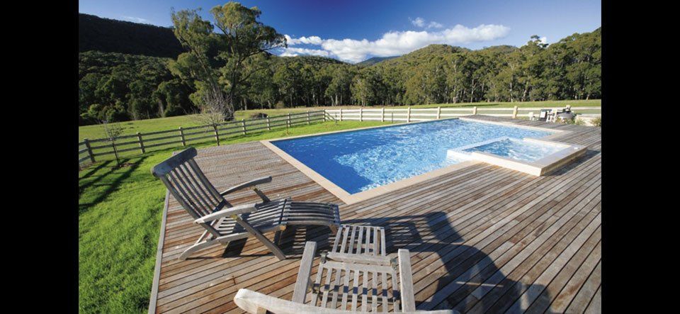View of outdoor pool with clear water