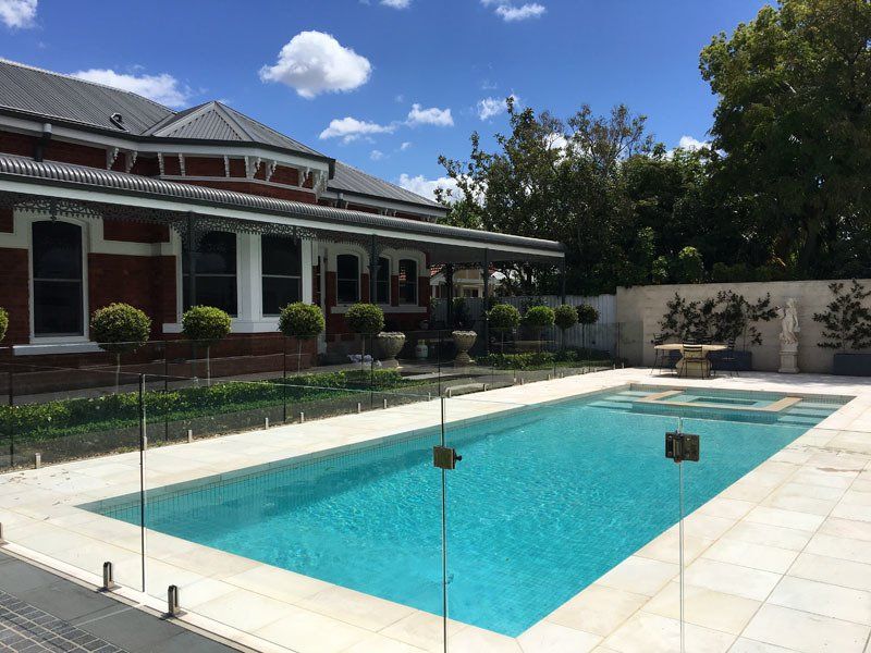 View of outdoor pool with clear water
