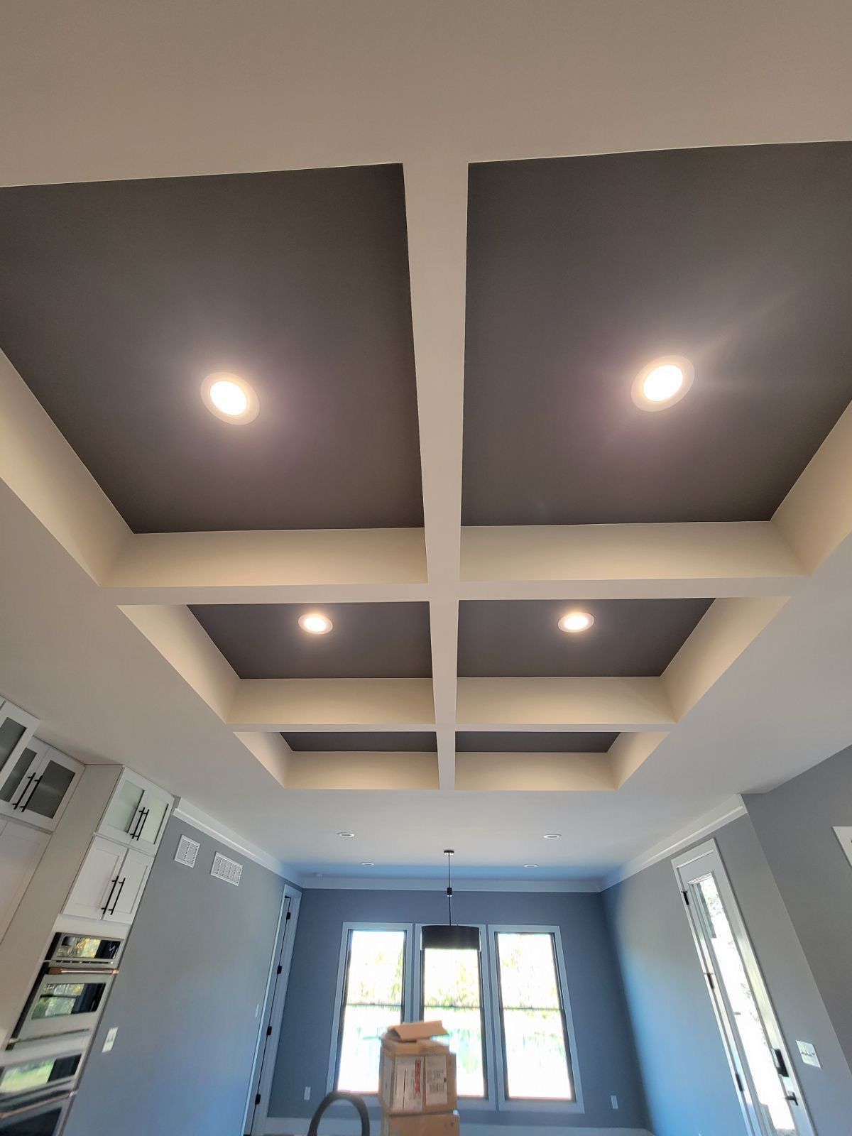 A room with a ceiling that has a lot of lights on it.