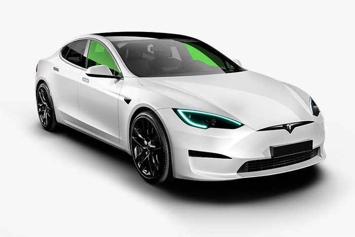 A white tesla model s with green windows on a white background.
