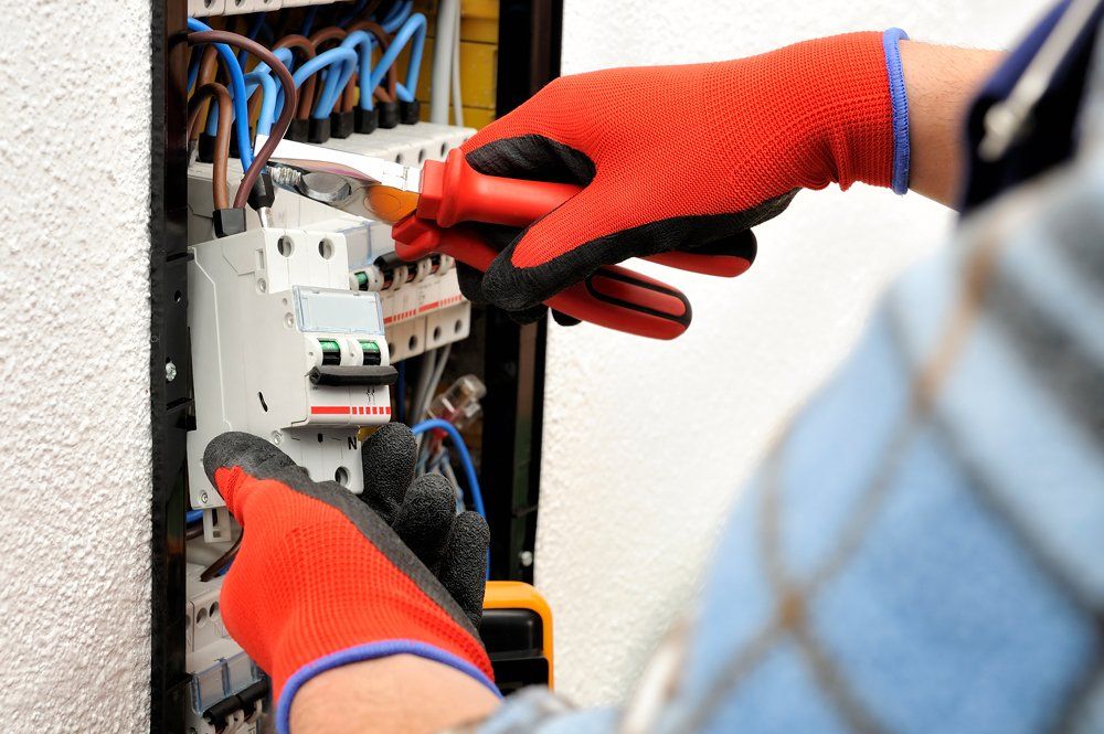 Technician At Work On An Electrical Panel — Highland, IN — Foster Electric Inc.