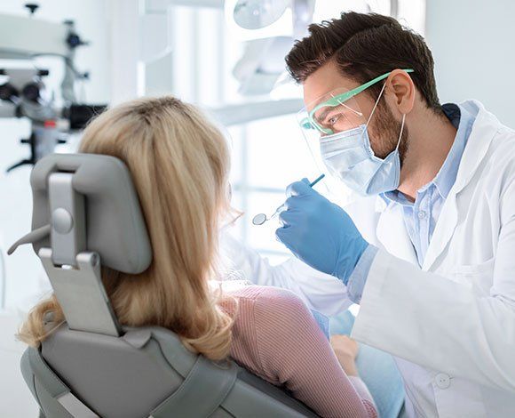 Dentist Checking Patient's Teeth — Haverhill, MA — Haverhill Dental Associates Inc