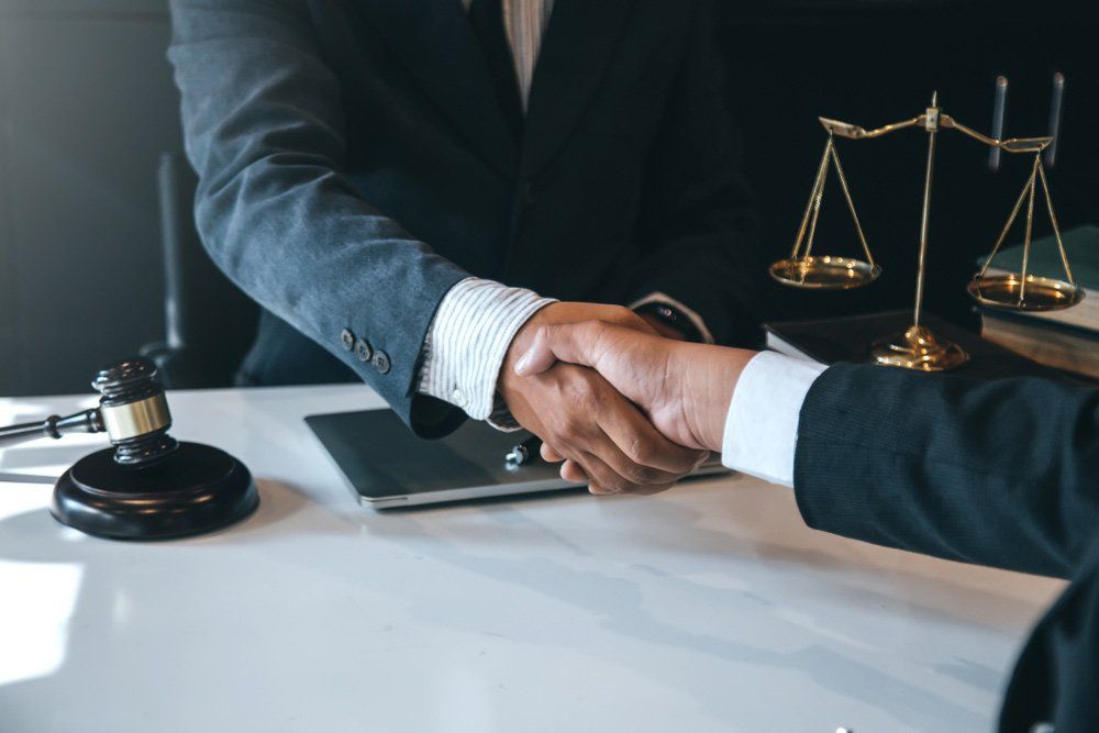 Businessman Shaking Hands to Seal a Deal — Commercial Property Law in Gladstone, QLD