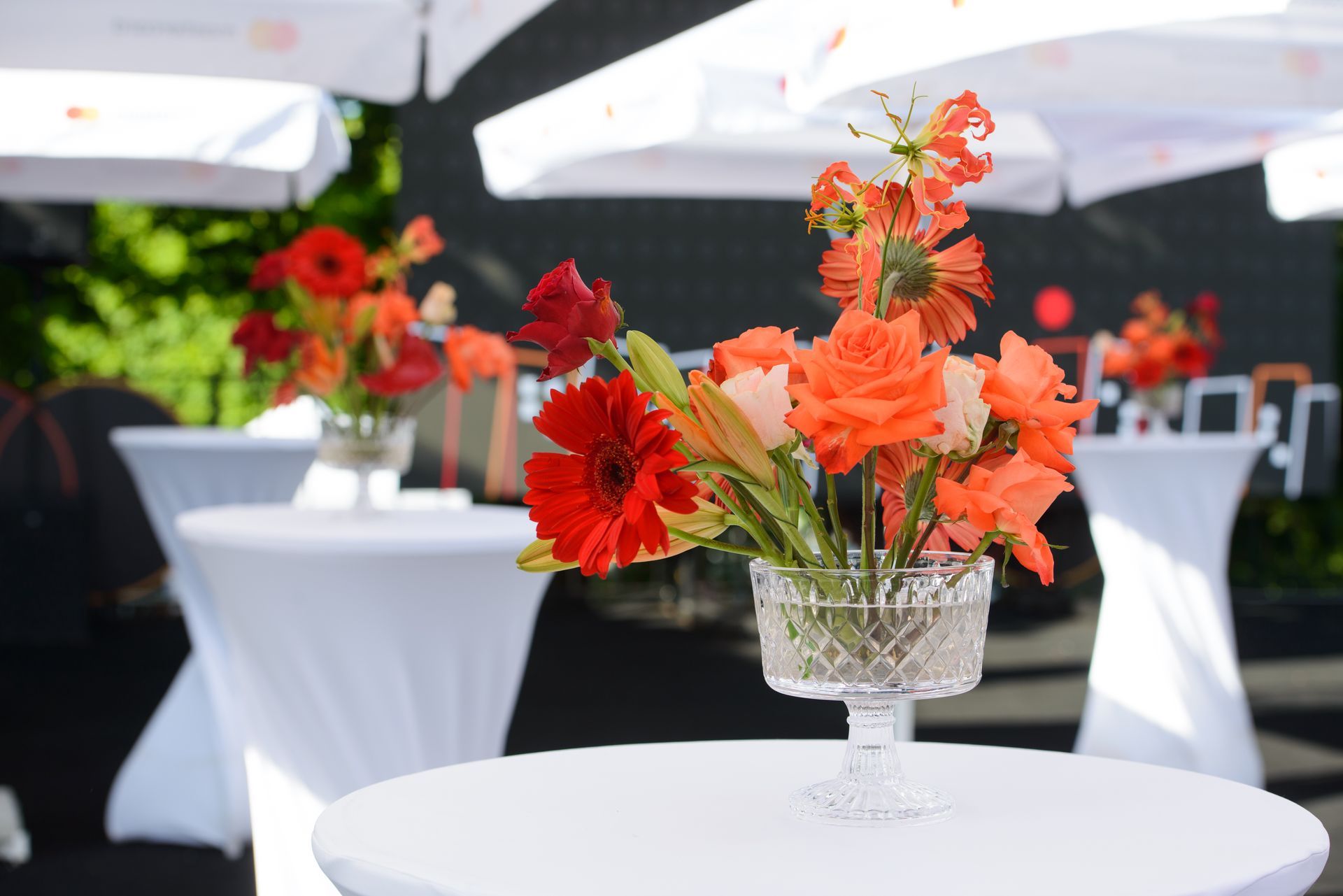 A table with a vase of flowers on it