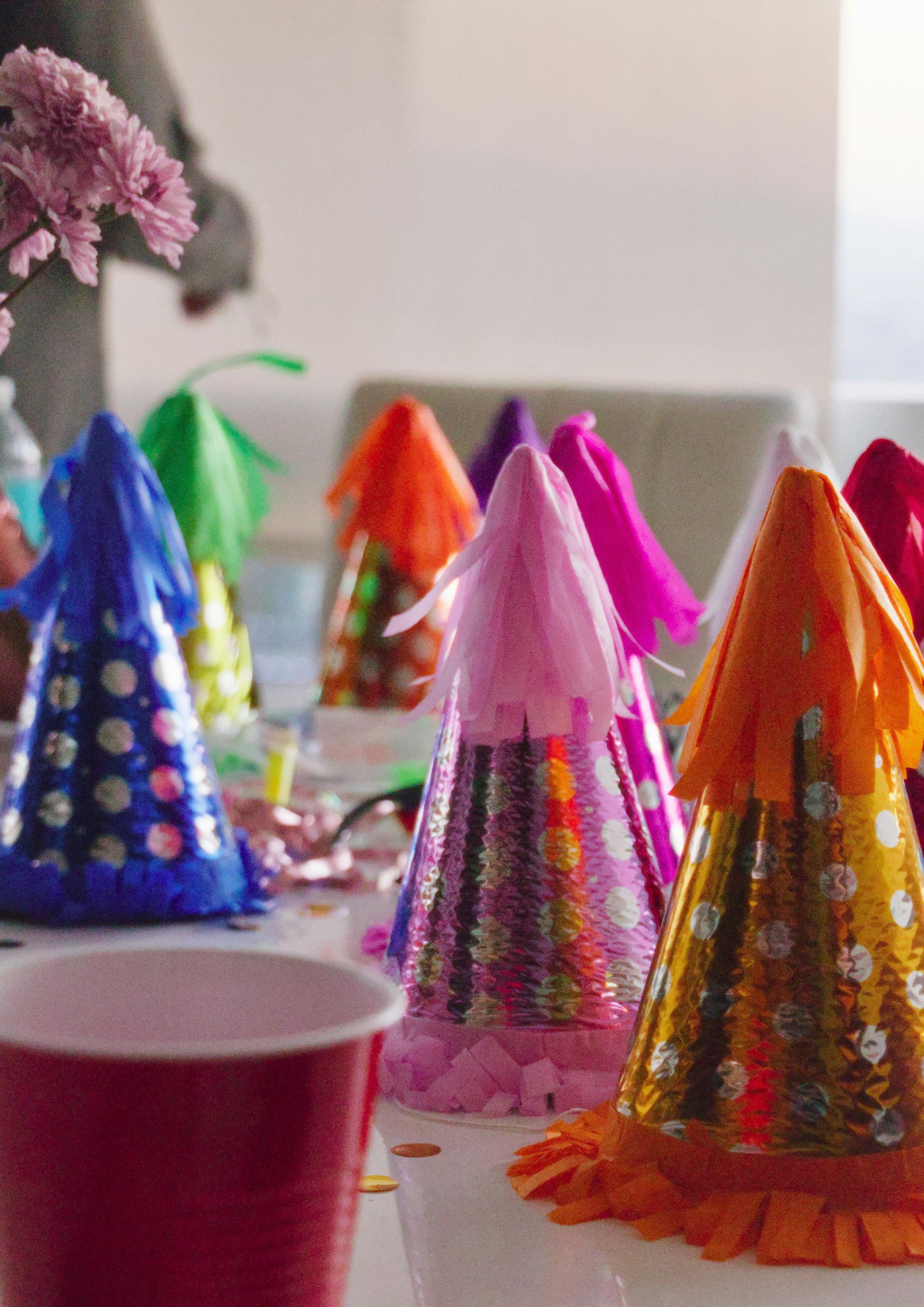 A bunch of party hats are sitting on a table
