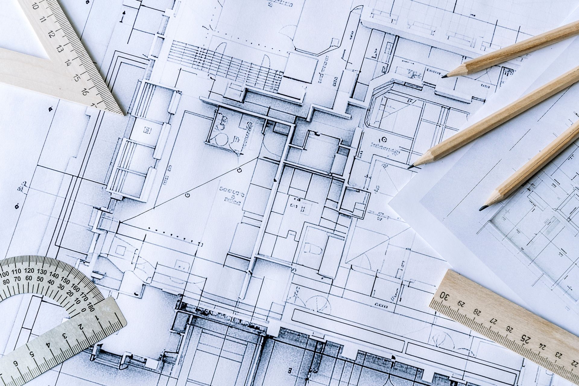 A drawing of a building with a ruler and pencils