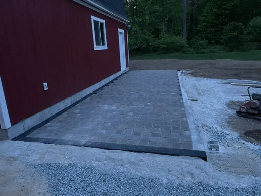 A red building with a patio in front of it