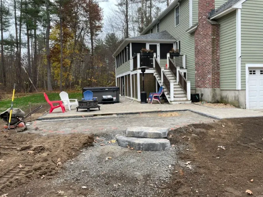 A house with a hot tub in the backyard is being built.
