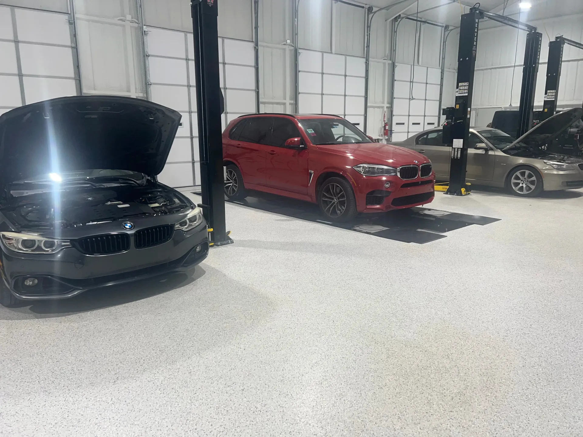 Three BMW Cars in a Garage | Dillon Auto Repair