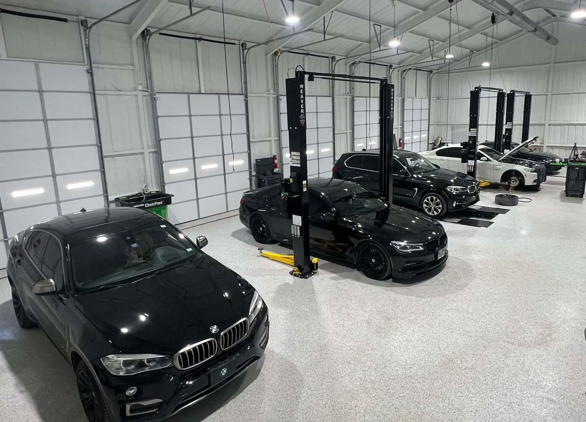 Auto Repair Shop with Multiple Cars on Lifts and in Service Bays | Dillon Auto Repair