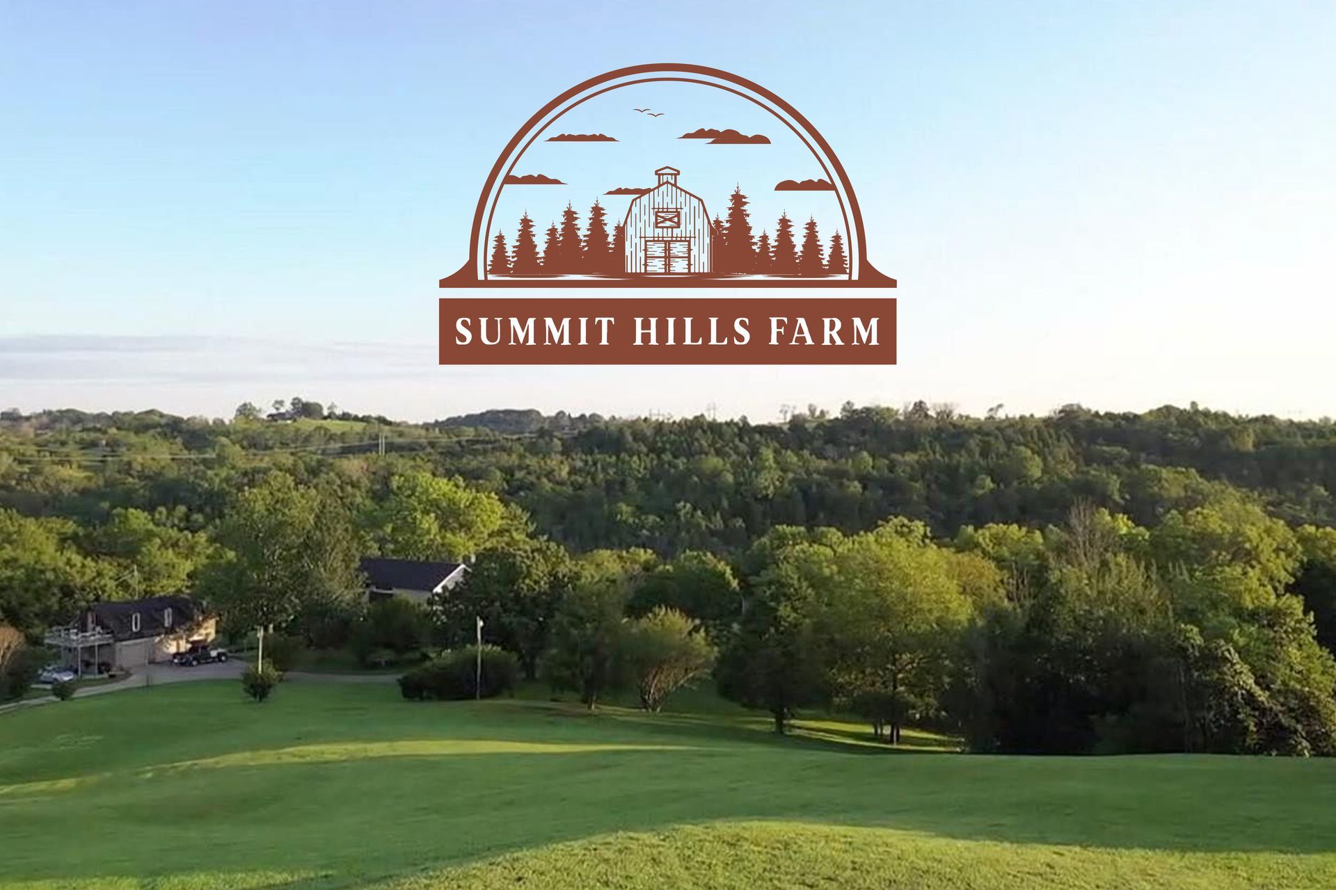 A logo for summit hills farm is above a lush green field