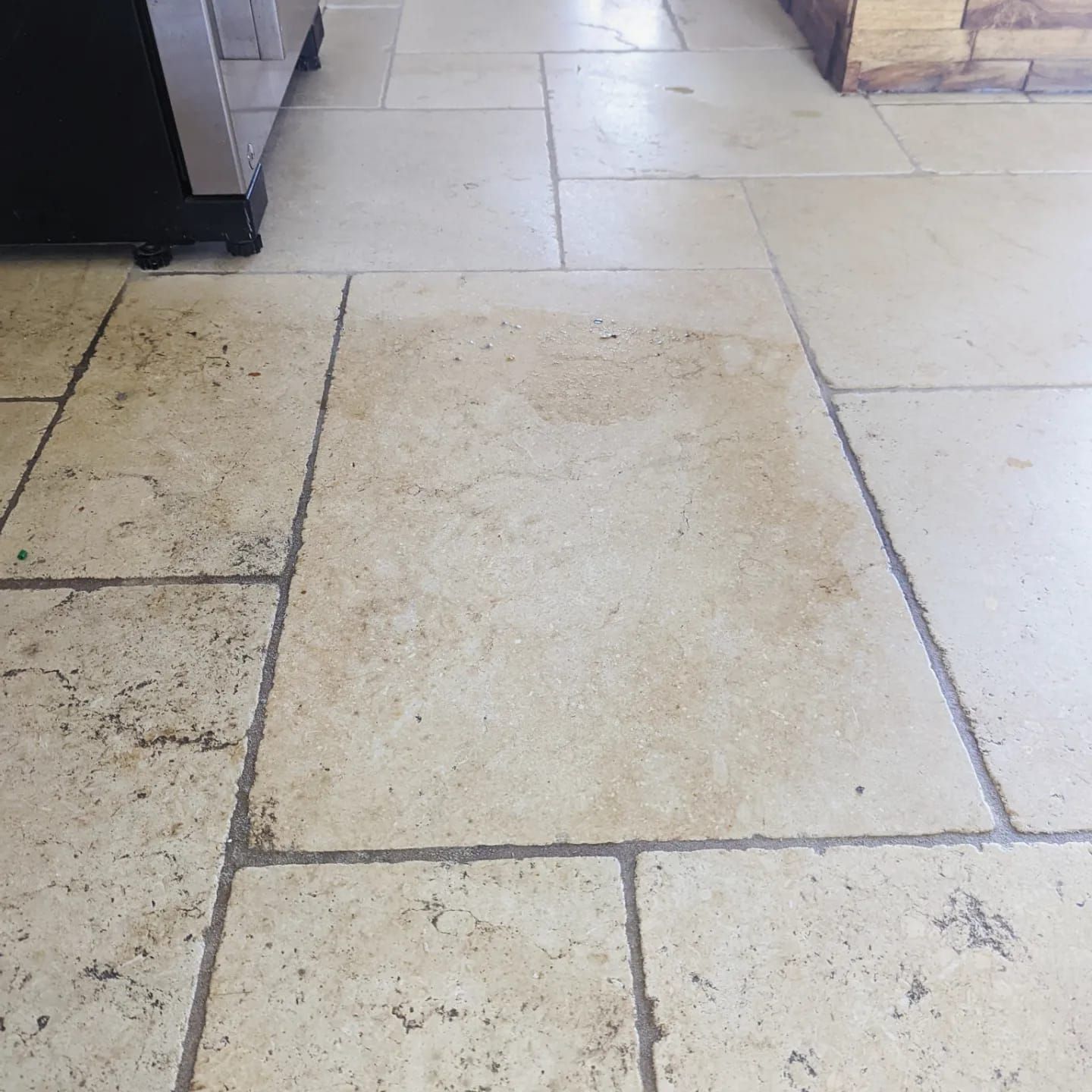 Limestone travertine deep cleaning, polishing, sealing and grout cleaning in Greater Manchester. Filling in holes with a resin filler.