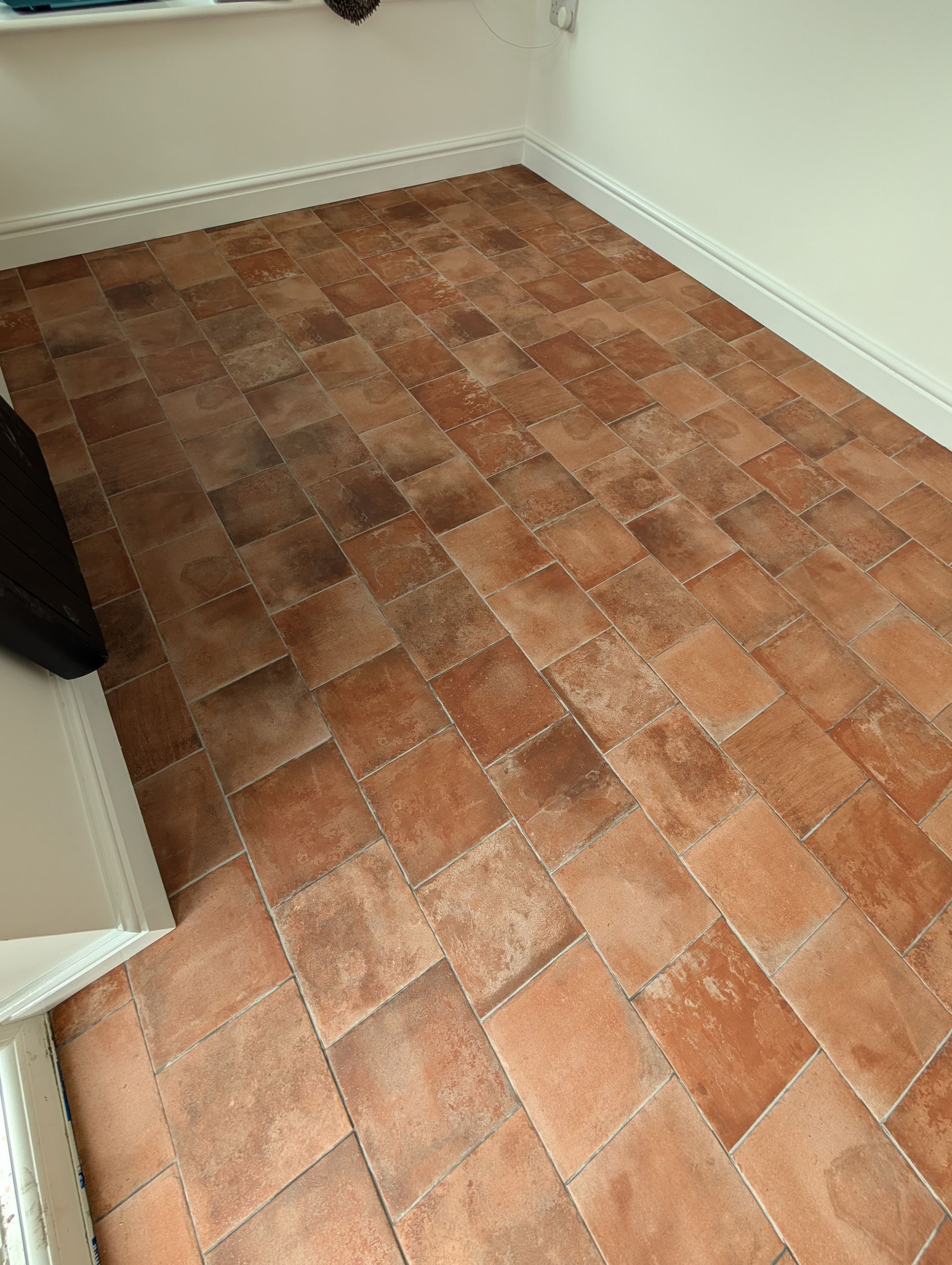 Terracotta tiles after professional post-construction clean and sealing by Quality Tile Care