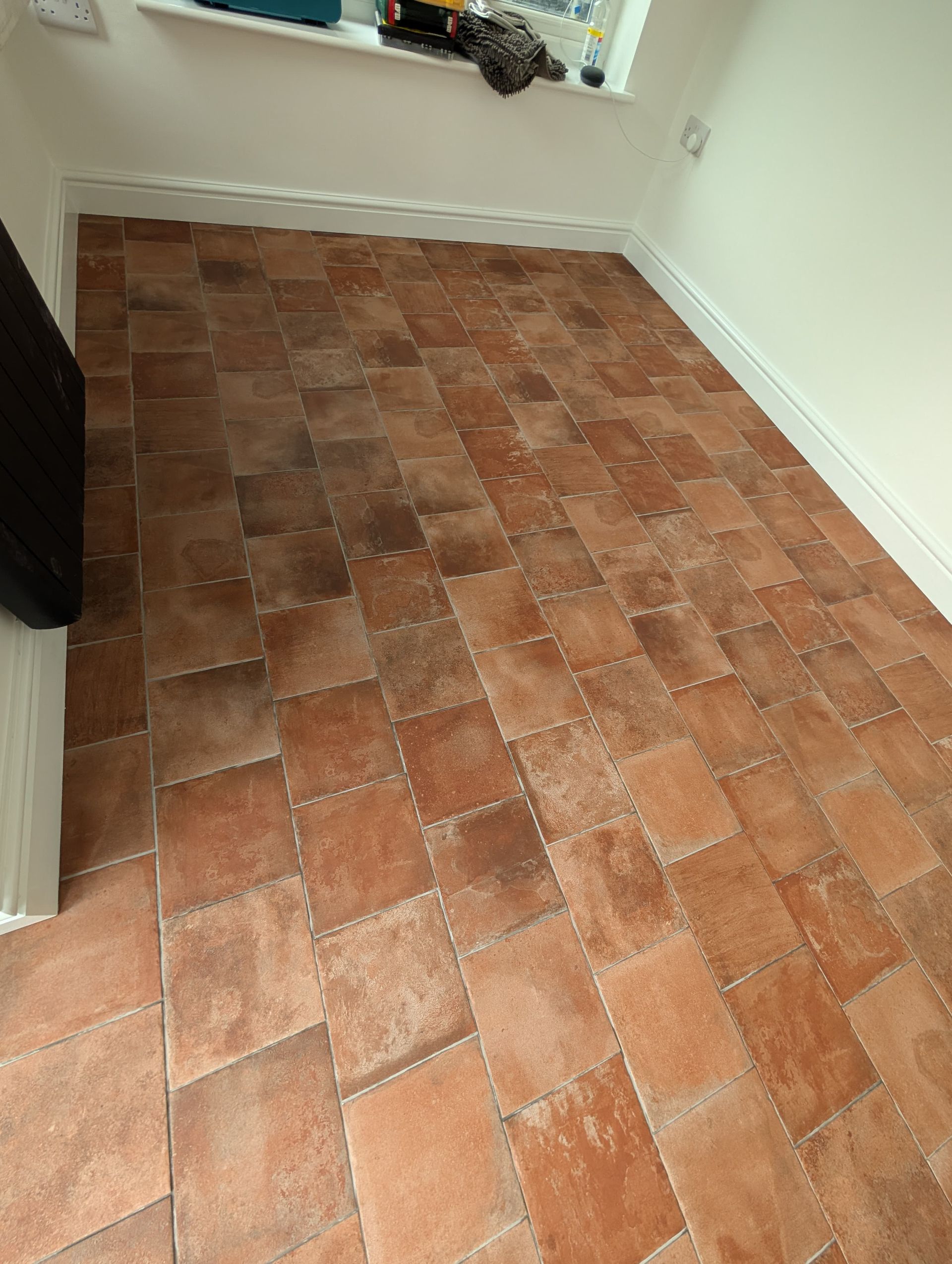 Terracotta tiles after professional post-construction clean and sealing by Quality Tile Care