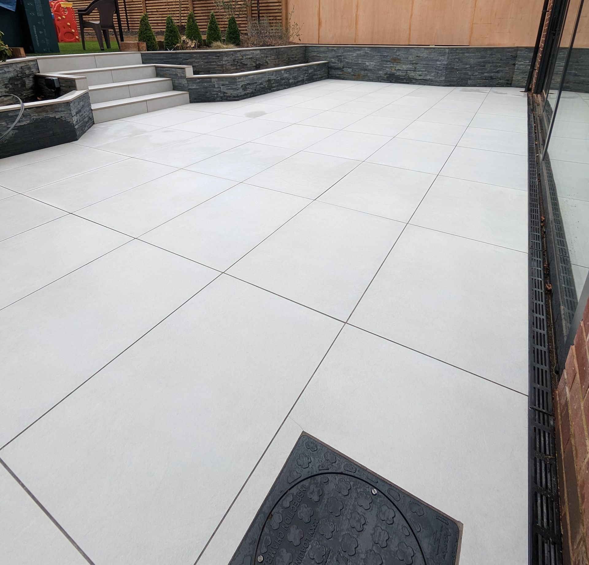 Porcelain tiled patio deep  cleaning in Manchester, including grout cleaning
