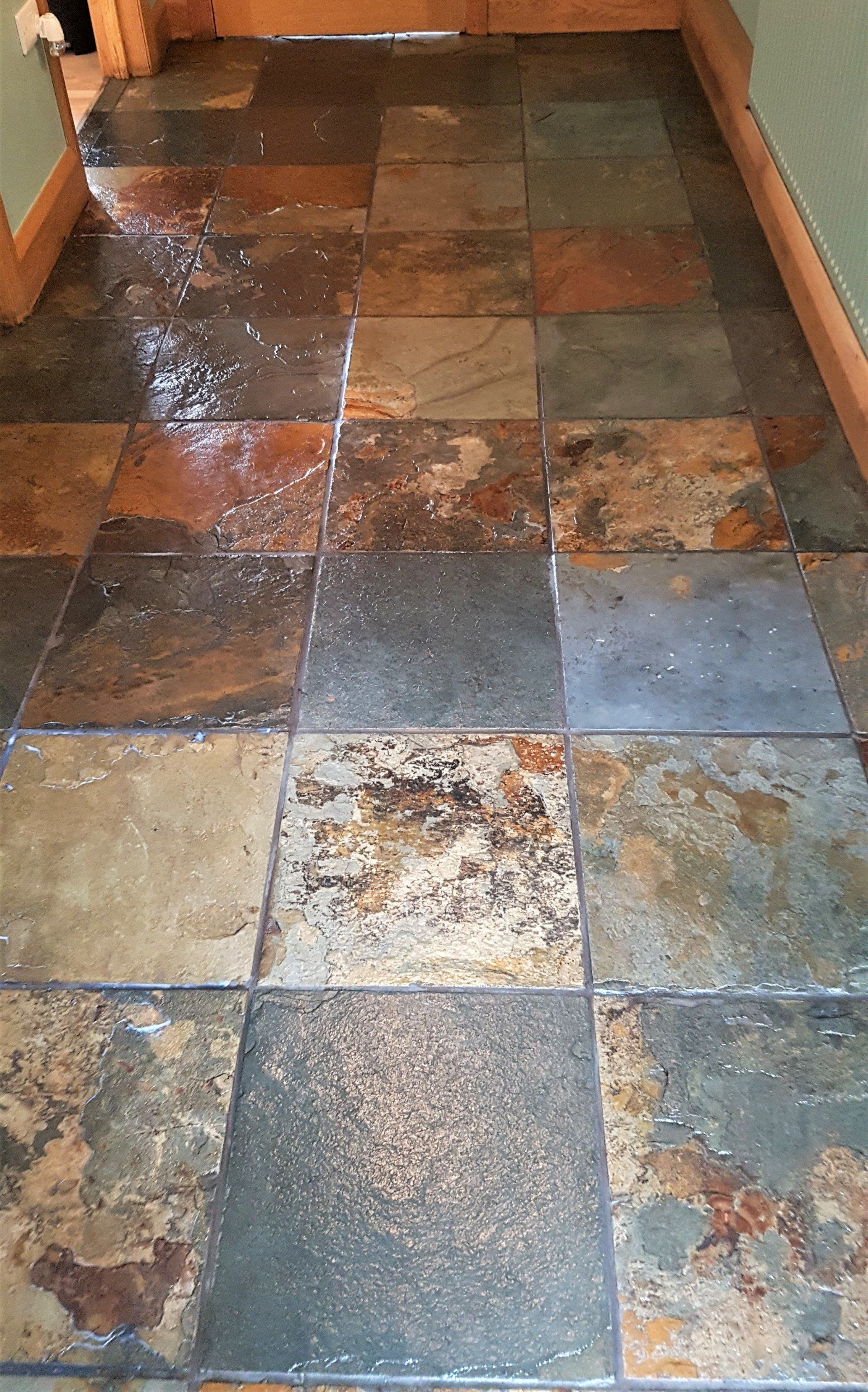 A hallway with a tiled floor and a door