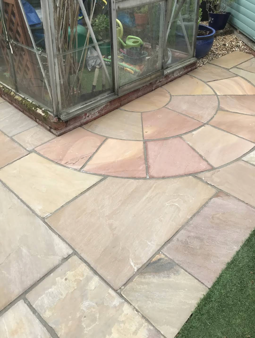 Indian Sandstone patio full restoration - deep cleaning, regrouting and sealing in Greater Manchester.