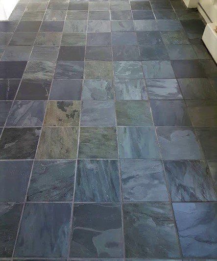 A close up of a tiled floor in a room.