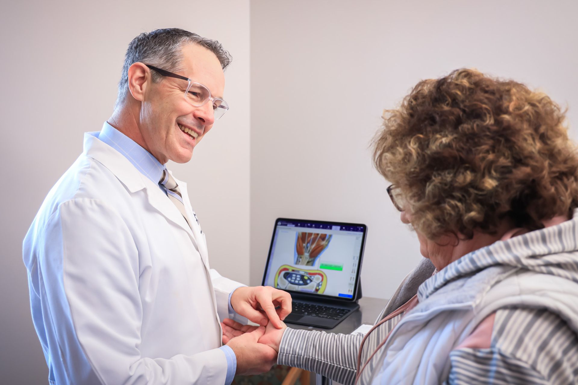 Richard Baumann, M.D.  with patient