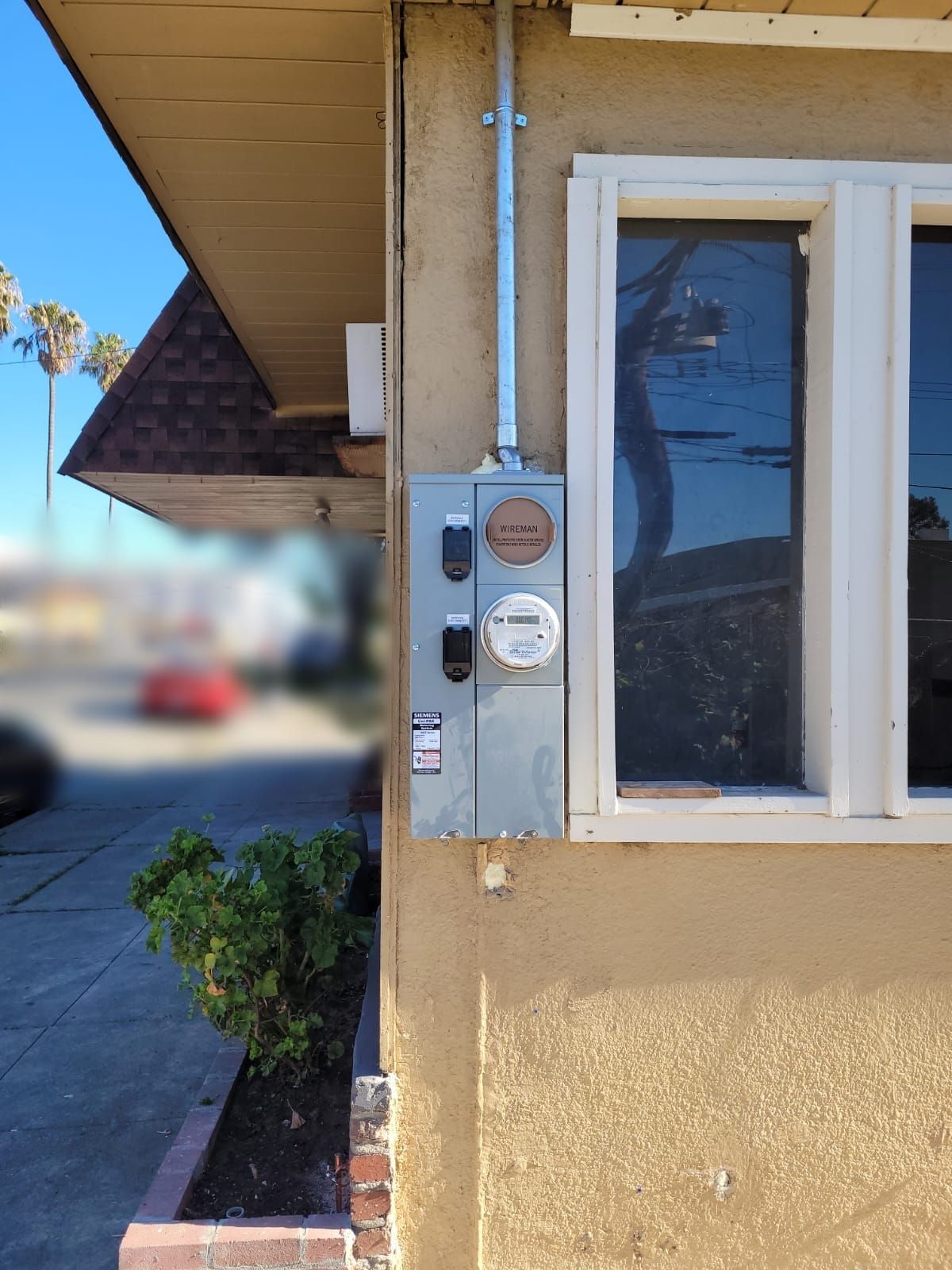 A building with a meter on the side of it