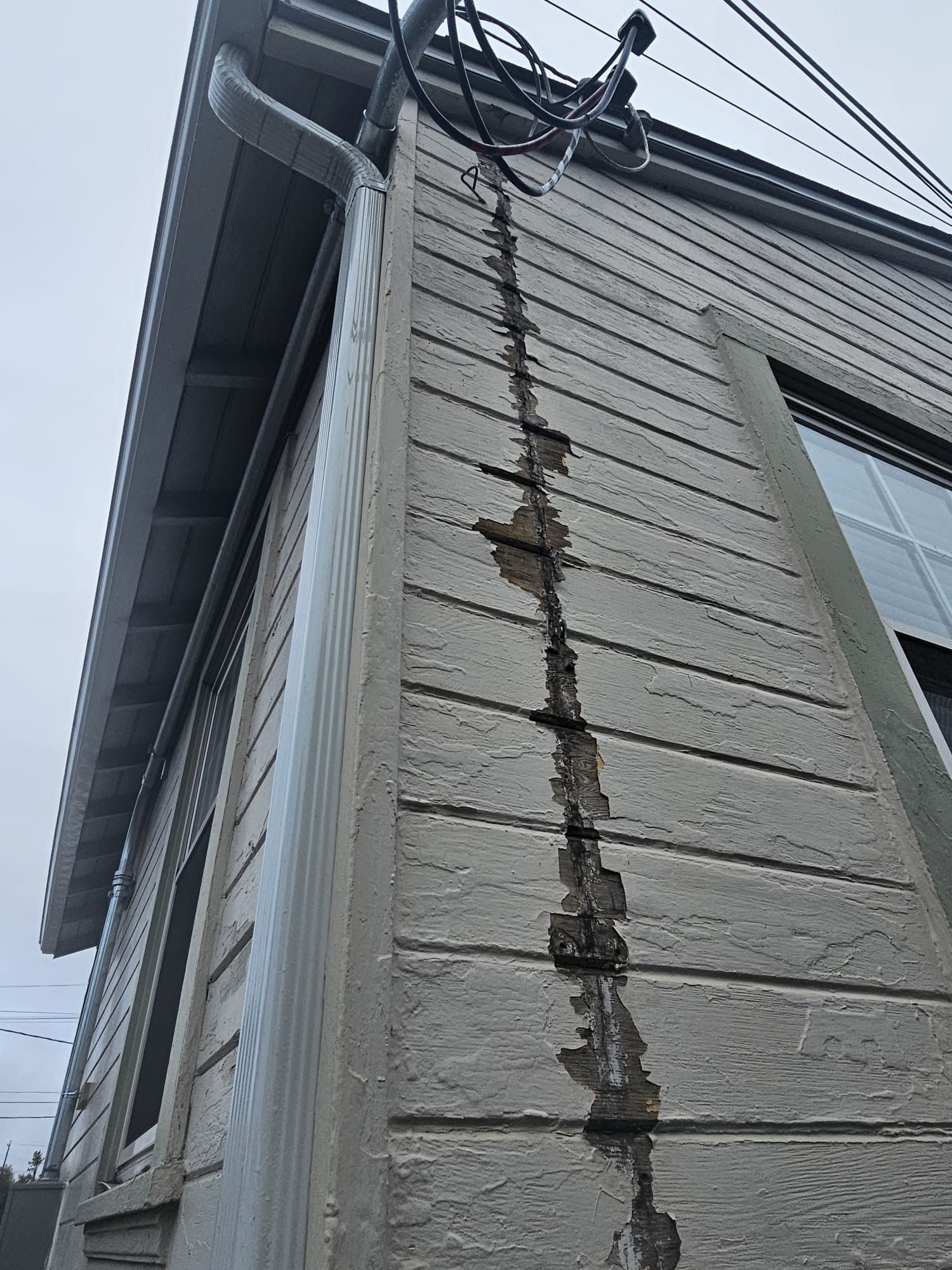 side of the house with a crack