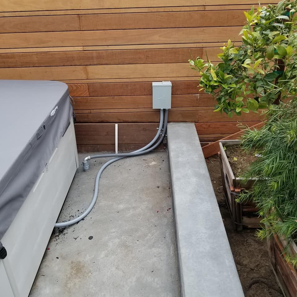 A hot tub with a hose attached to it