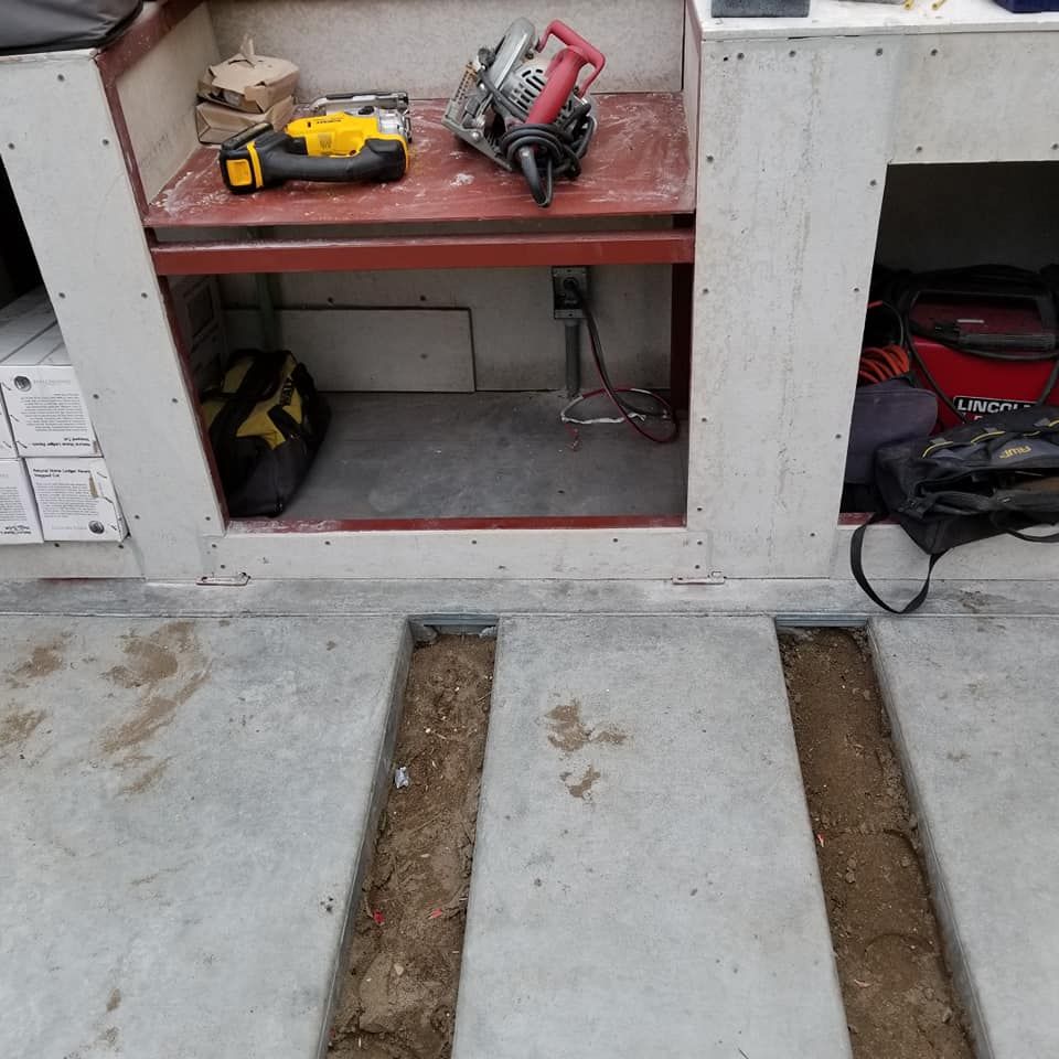 A circular saw is sitting on top of a wooden table